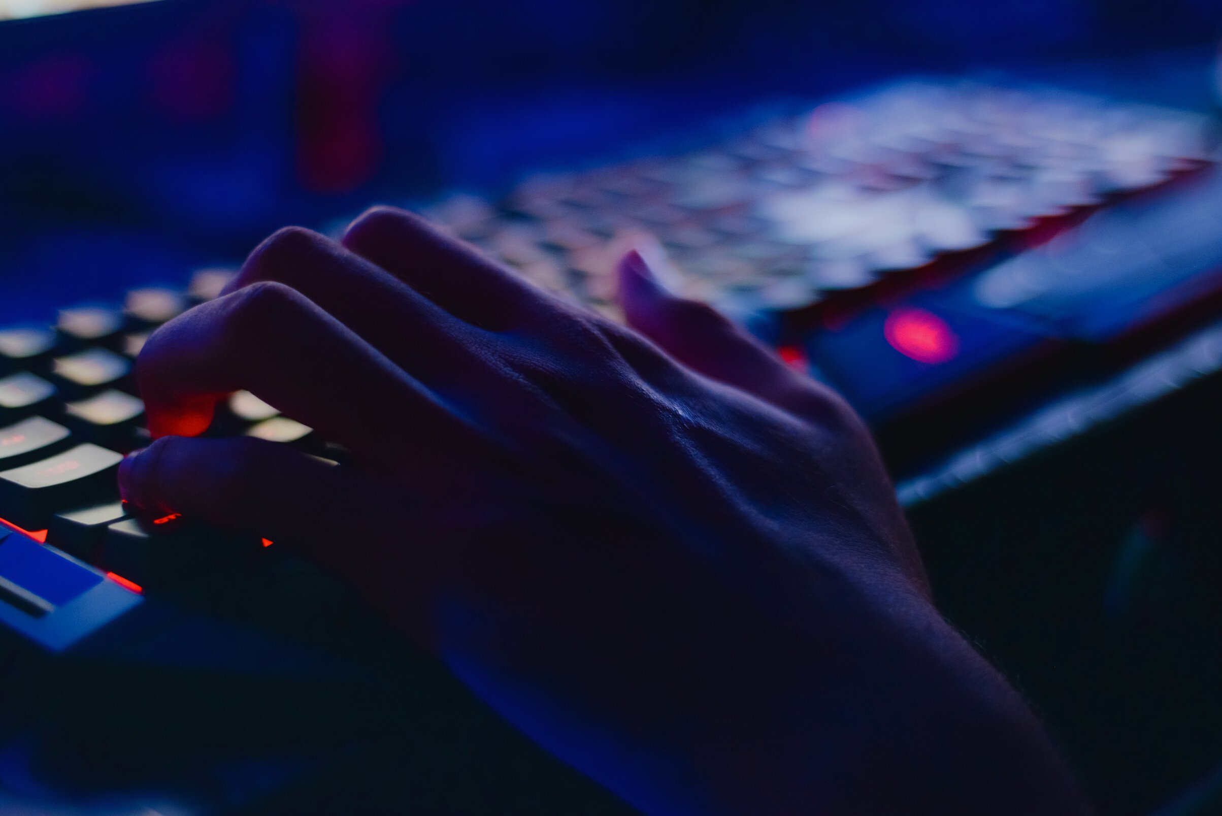 Photo of Person Typing on Computer Keyboard